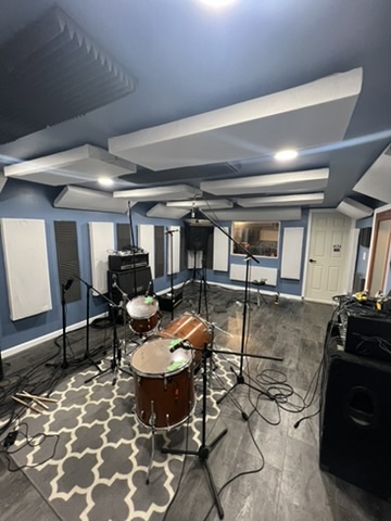 Billiam Records live room set up with drums, microphones, and acoustic panels